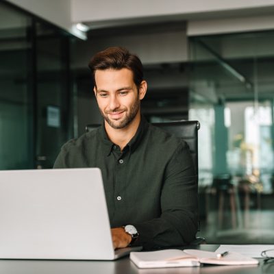 happy,latin,hispanic,young,business,man,working,on,laptop,computer